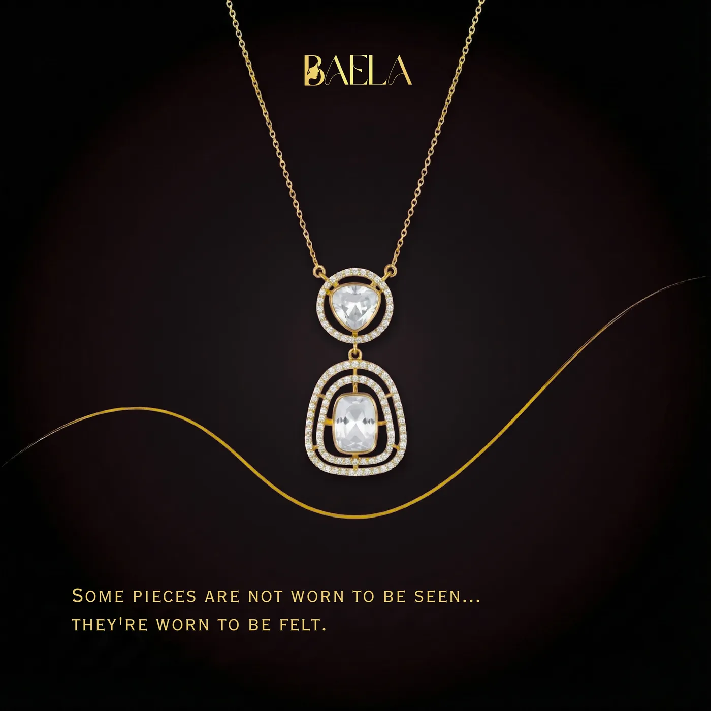 Campaign artwork: a Baela pendant on a fine chain against near-black, above the line some pieces are not worn to be seen.