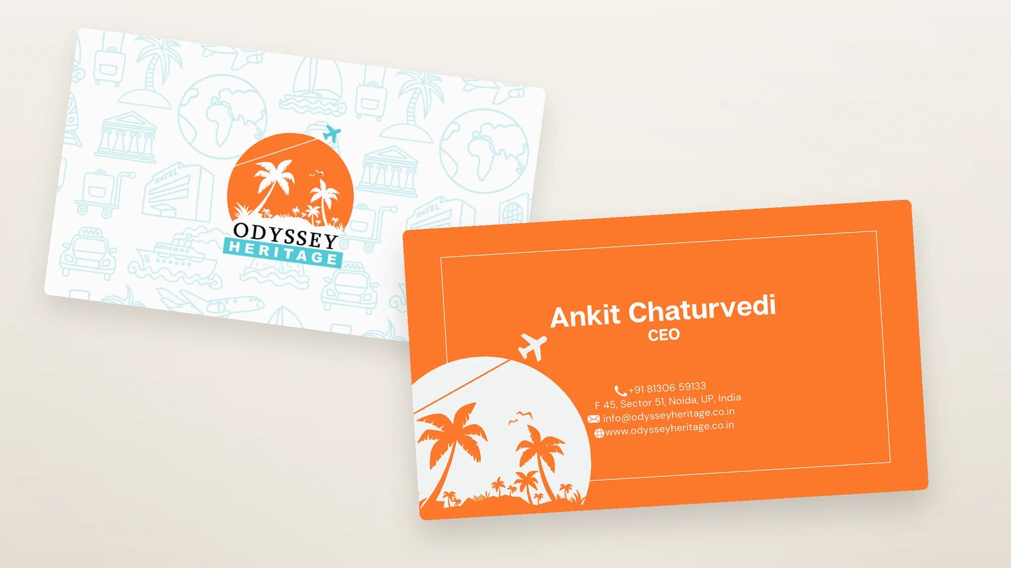 Both faces of the Odyssey Heritage card, angled and overlapping on warm sand: the reverse carrying the mark on a pale teal pattern of palms, planes, ships and passports, and the front in orange with the holder's name, title and contact details.