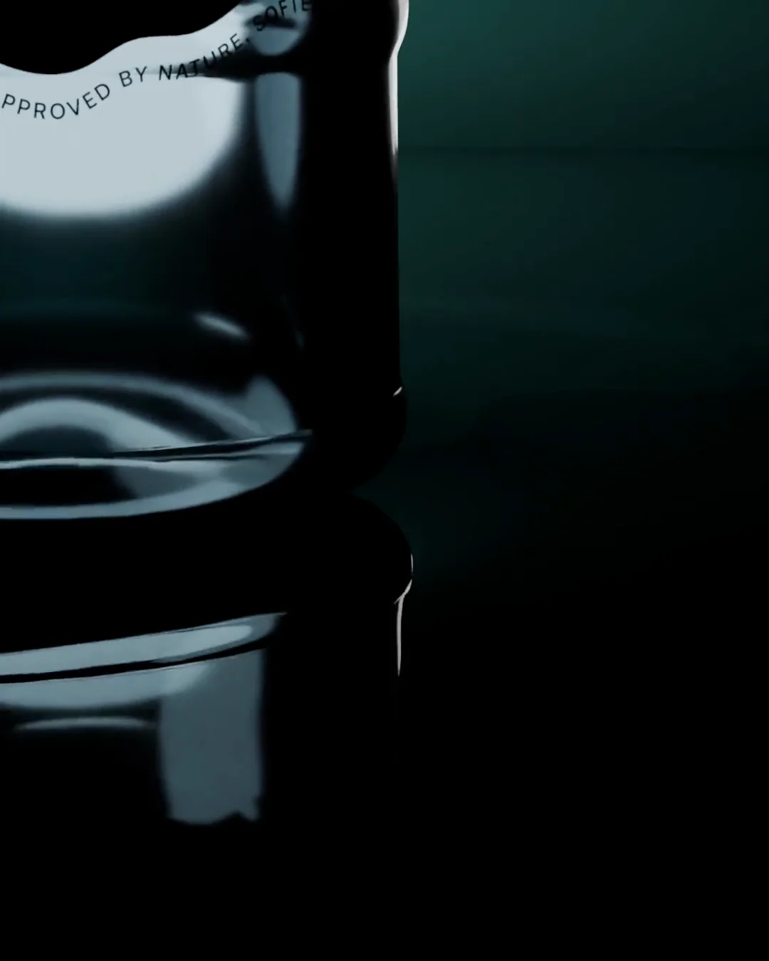 A 3D render of the glass vessel turning slowly on a dark reflective surface, the words approved by nature curving around its seal.